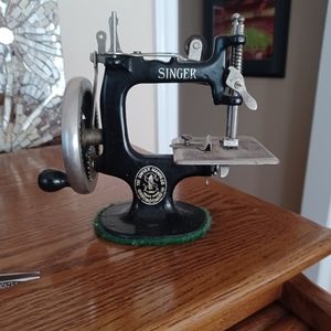 Antique Singer toy sewing machine